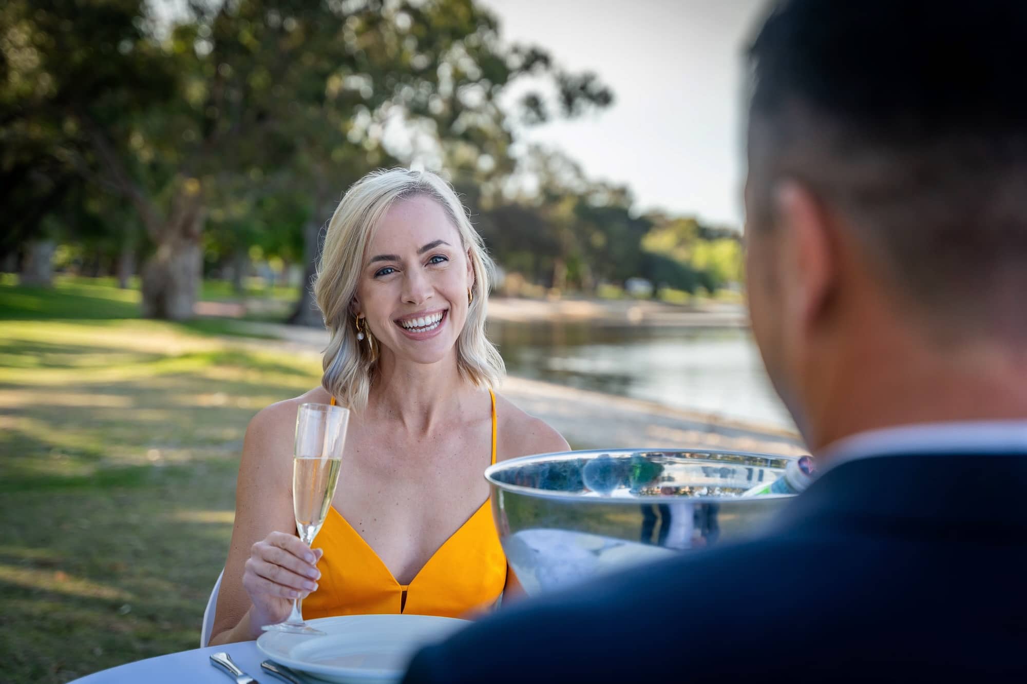 Woman on date holding champagne