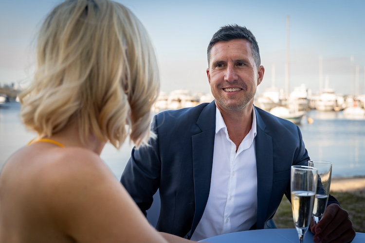 Guy smiling at lady on a date